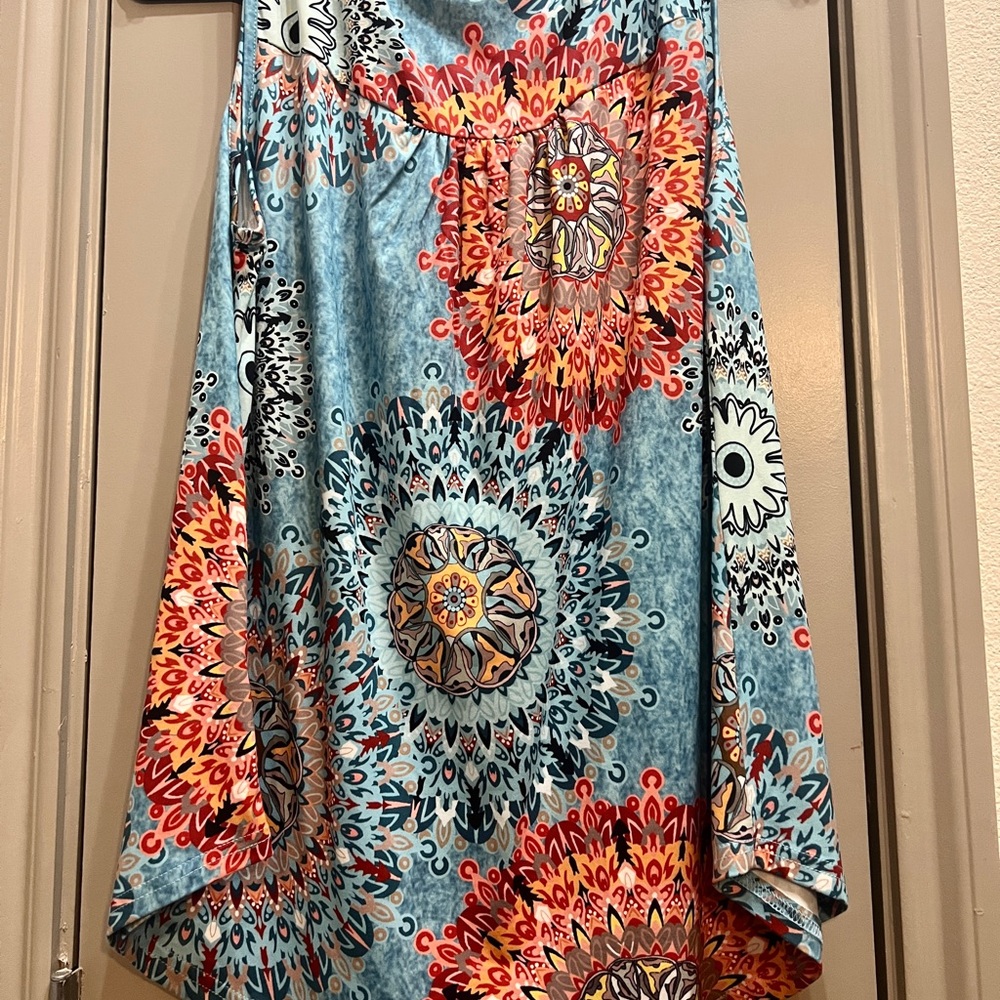 Size L ladies sleeveless blouse, never worn.